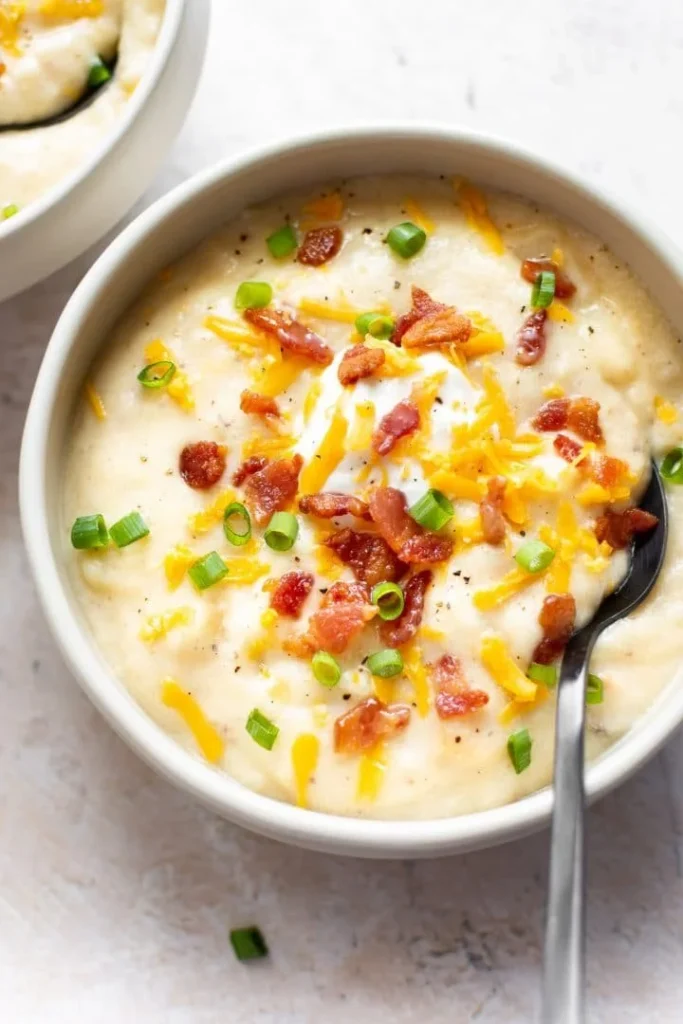 Easy baked potato soup served in a bowl with toppings